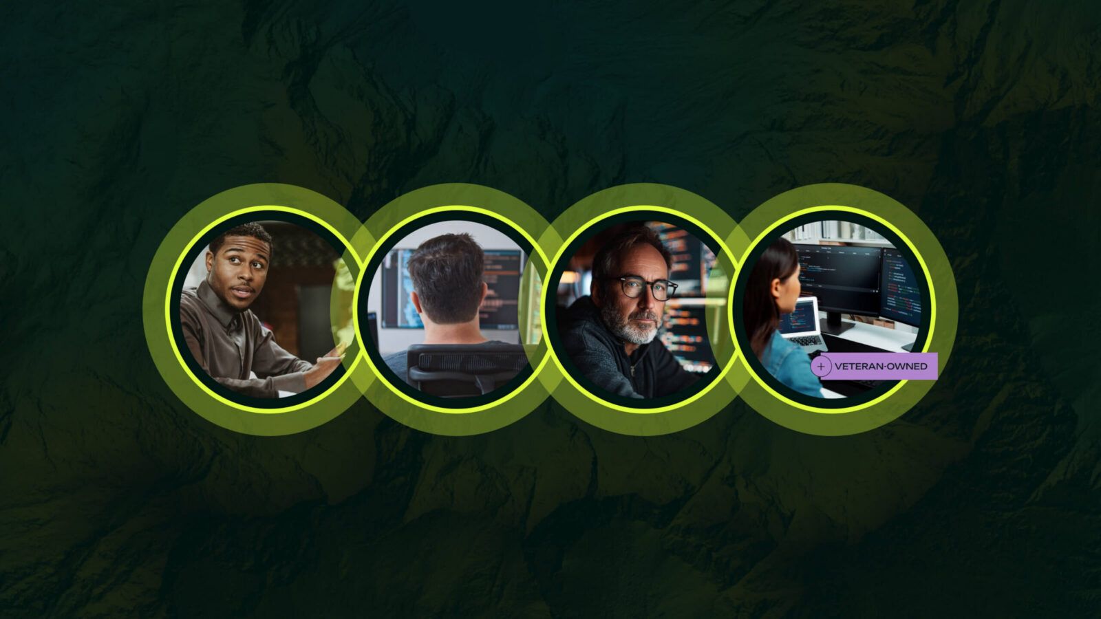 Four people working on computers, with a label indicating one is veteran-owned.
