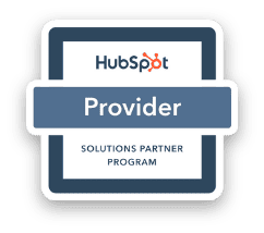 A HubSpot Provider badge with a tablet displaying the HubSpot logo and the words "Solutions Partner Program."