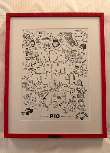 A framed black-and-white doodle illustration with the phrase "Add Some Punch" in the center, surrounded by various playful