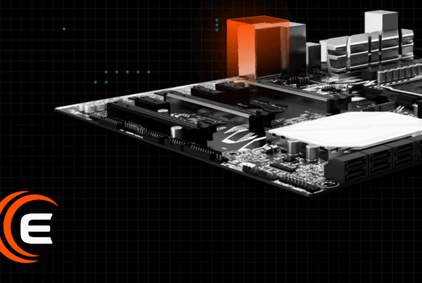 A computer motherboard with a highlighted orange component and a logo in the bottom left corner.