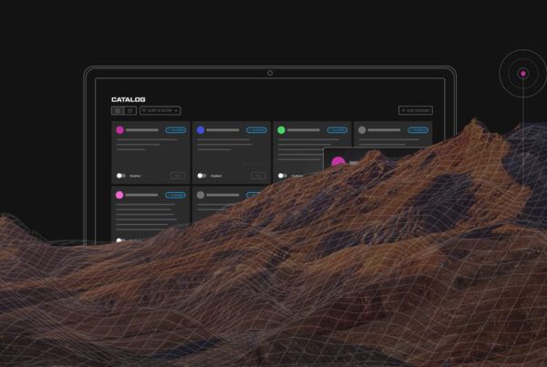 A digital landscape with a wireframe mountain range in front of a computer screen displaying a data catalog interface.