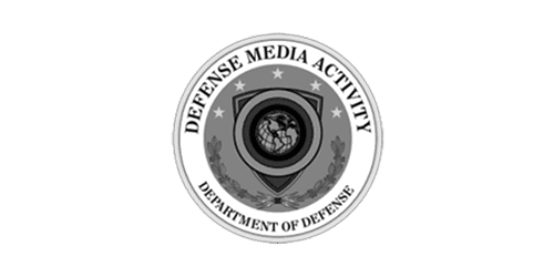 A circular emblem with a shield, globe, and laurel wreath, featuring the text "Defense Media Activity" and "Department of